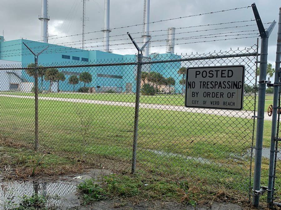 Power plant site as it looks now through fence Power plant site as it looks now through fence